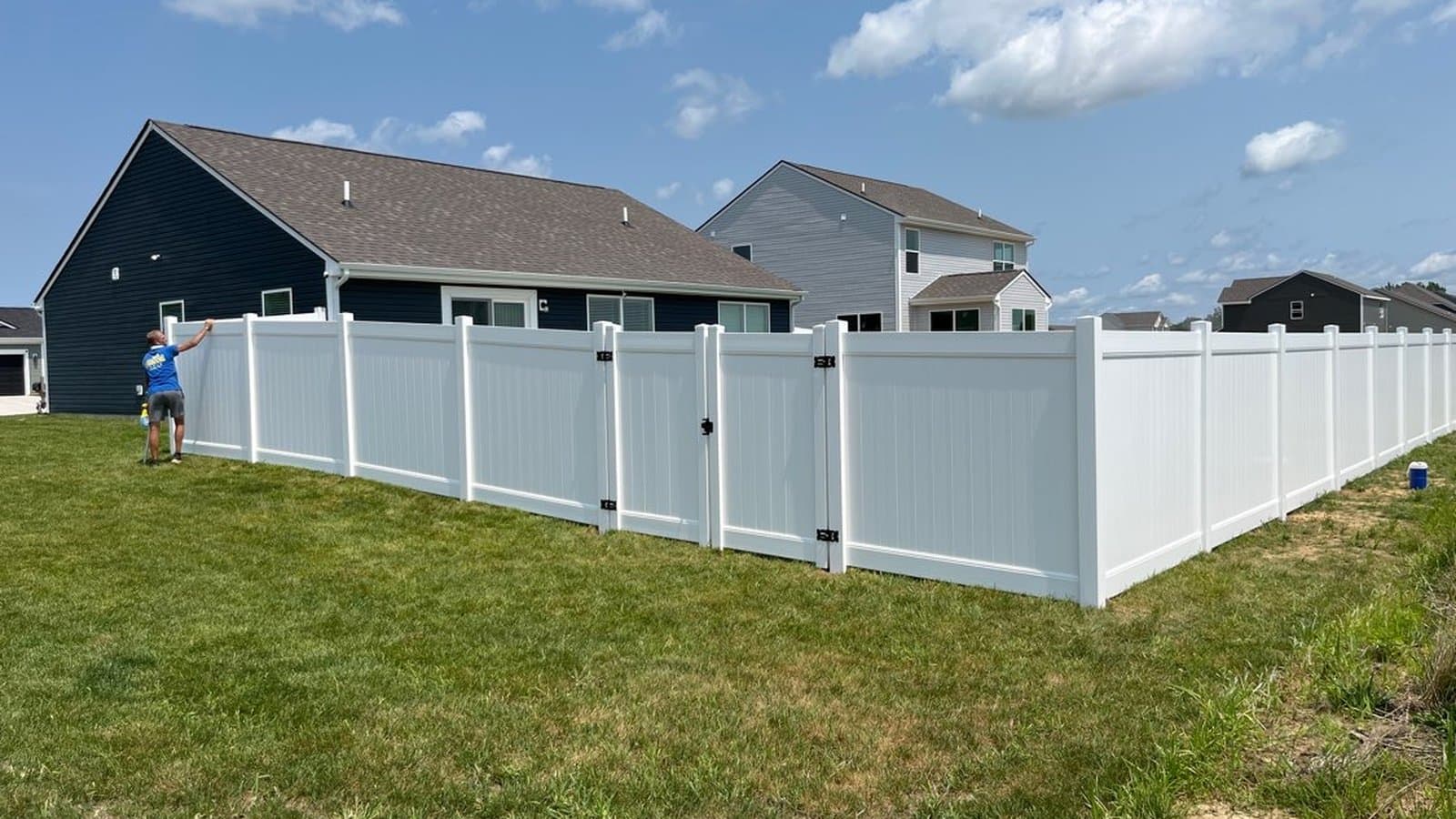 White vinyl privacy fence with a gate in a Russiaville, IN backyard